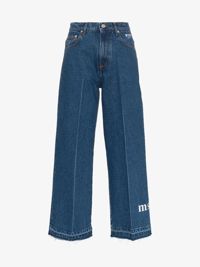 Shop Msgm Cropped Logo Jeans In Blue