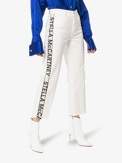 Shop Stella Mccartney Logo Strip Cropped Jeans In 9110 Bianco