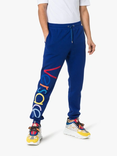 Shop Versace Embroidered Logo Sweatpants In 102 - Blue