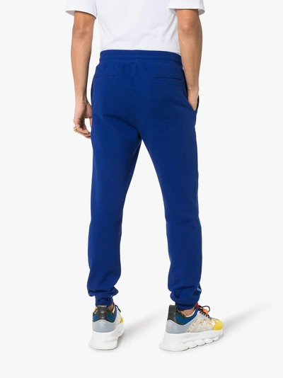 Shop Versace Embroidered Logo Sweatpants In 102 - Blue