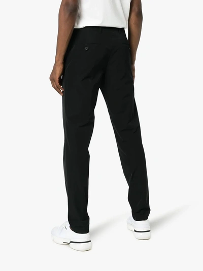 Shop Prada Light Stretch Technical Trousers In Black