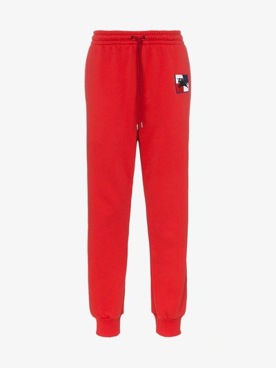 Shop Burberry Embroidered Logo Track Pants In 1002 Red