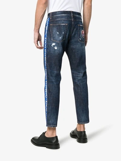 Shop Dolce & Gabbana Cropped Distressed Slim Ticker Jeans In Blue