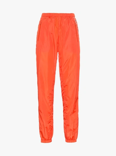 Shop Prada Logo Print Track Pants In Orange