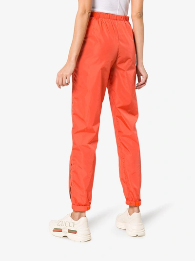 Shop Prada Logo Print Track Pants In Orange