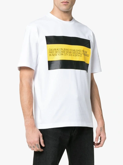 Shop Calvin Klein Jeans Est.1978 Calvin Klein Jeans Est. 1978 Front Flag T-shirt In 001 White/black/yellow Flag