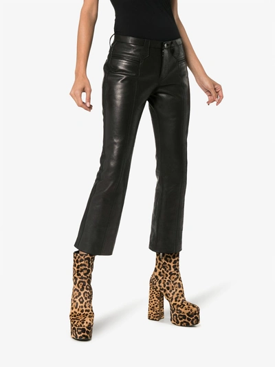 Shop Saint Laurent Kick Flare Leather Trousers In Black