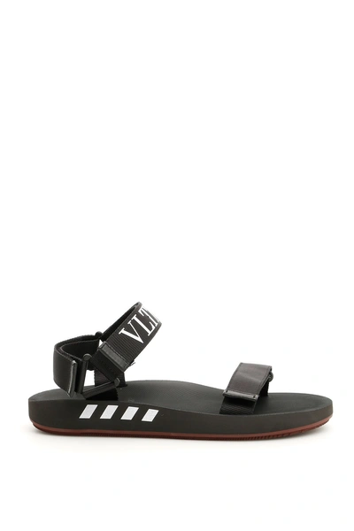 Shop Valentino Vltn Strap Sandals In Nero Bianco|nero