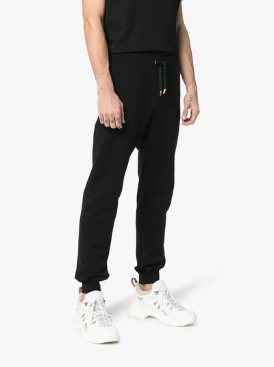 Shop Versace Embroidered Medusa Logo Cotton Sweatpants In Black