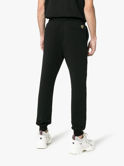 Shop Versace Embroidered Medusa Logo Cotton Sweatpants In Black