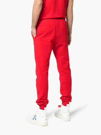 Shop Versace Logo Embroidered Cotton Track Pants In Red