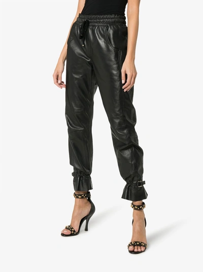 Shop Skiim Gaby High-waisted Leather Track Pants In Black