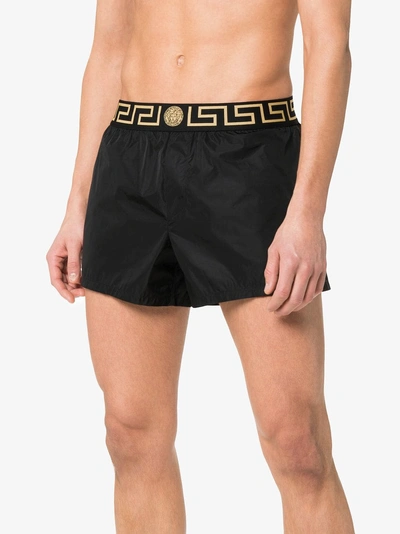 Shop Versace Greca Border Swim Shorts In Black