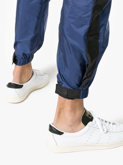 Shop Prada Logo Cuff Trousers In Blue