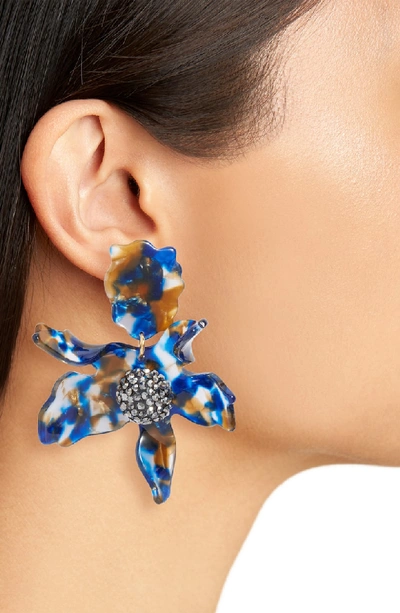 Shop Lele Sadoughi Crystal Lily Clip Earrings In Night Streak