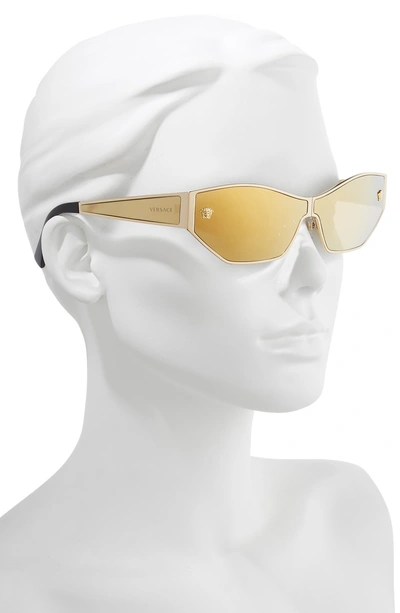 Shop Versace 66mm Shield Sunglasses - Gold Mirror