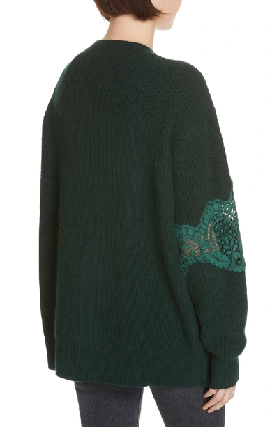 Shop Sandro Tower Lace Inset Wool Blend Cardigan In Bottle Green