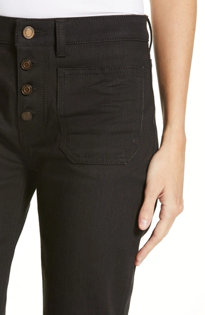 Shop Saint Laurent Patch Pocket Flare Jeans In Used Black