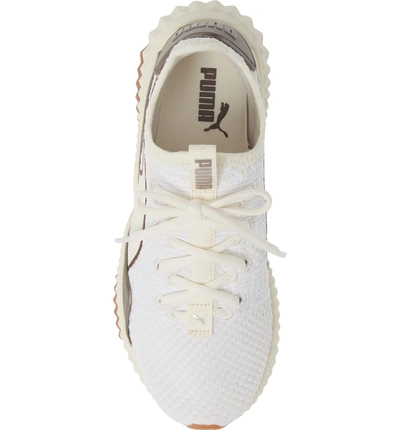 Shop Puma Defy Luxe Sneaker In Whisper White/ Metallic Ash