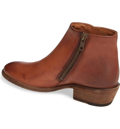 Shop Frye Carson Piping Bootie In Cognac