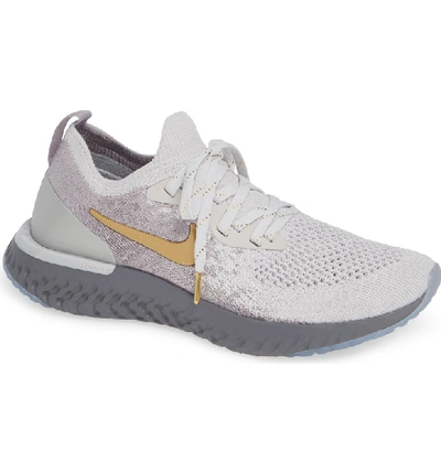 Shop Nike Epic React Flyknit Running Shoe In Grey/ Metallic Gold- Platinum