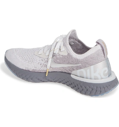 Shop Nike Epic React Flyknit Running Shoe In Grey/ Metallic Gold- Platinum