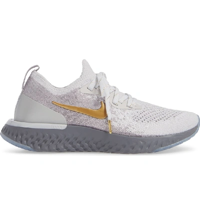 Shop Nike Epic React Flyknit Running Shoe In Grey/ Metallic Gold- Platinum