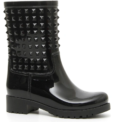 Shop Valentino Rockstud Waterproof Rain Boot In Black