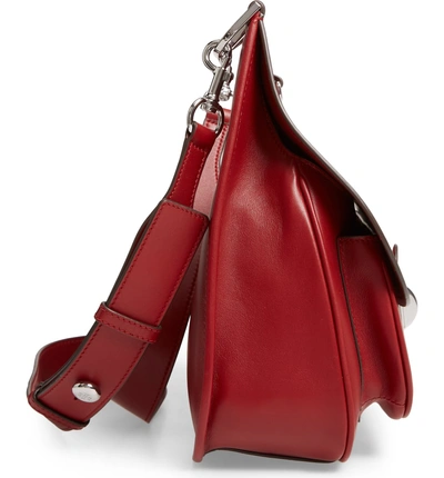 Shop Tory Burch James Leather Saddle Bag - Red In Coffee Berry