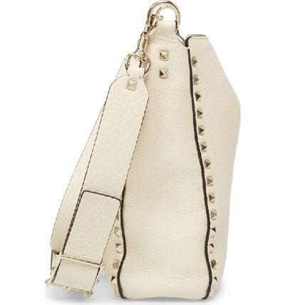 Shop Valentino Small Rockstud Leather Hobo - Ivory In Ivory/ Gold