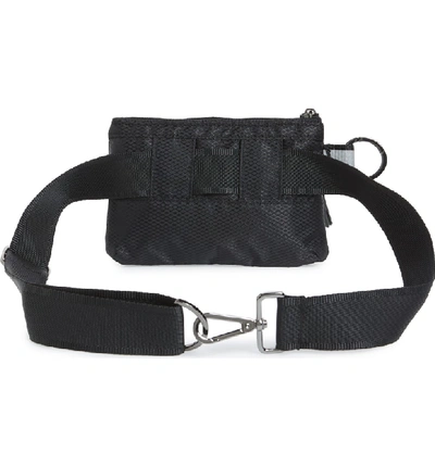 Shop Andi Urban Clutch Convertible Belt Bag In Black/ Reflective Stripe