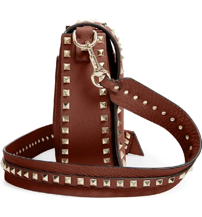 Shop Valentino Rockstud Leather Saddle Bag - Brown In Bright Cognac
