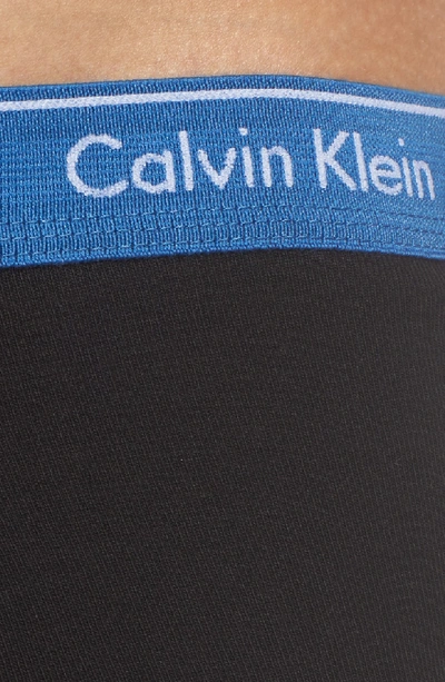 Shop Calvin Klein 4-pack Cotton Briefs In Black W/ Oriole/ Stony/ White