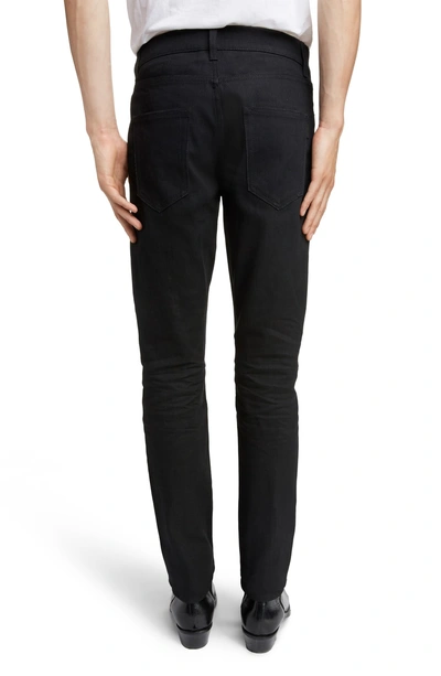 Shop Saint Laurent Skinny Fit Jeans In Black Raw