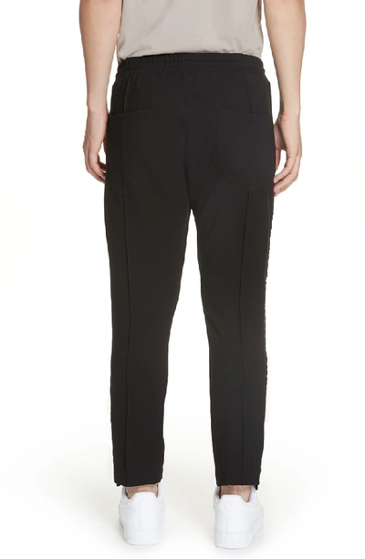 Shop Rhude Stripe Slim Fit Pants In Black