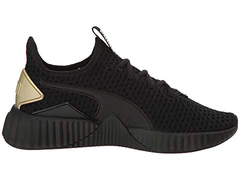 puma defy varsity black and gold