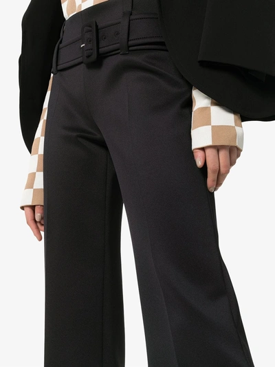 Shop Prada High Waisted Belted Ruffle Hem Trousers In Nero
