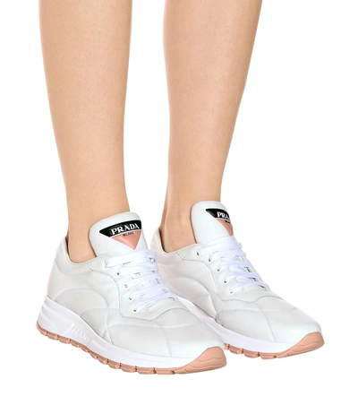 Shop Prada Prax-01 Leather Sneakers In White