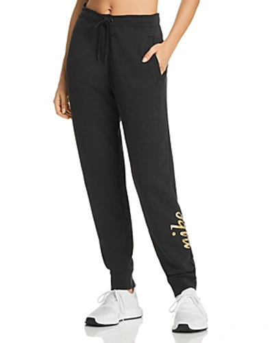 Shop Nike Rally Metallic Logo Jogger Pants In Black