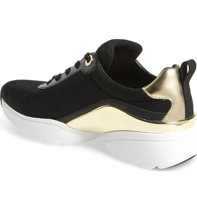 Shop Michael Michael Kors Jada Metallic Sneaker In Black/ Gold Multi