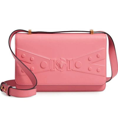 Shop Versace Tribute Embossed Leather Crossbody Bag - Pink In Shell Pink/ Tribute Gold