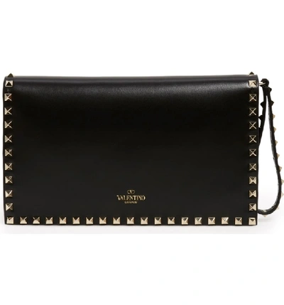 Shop Valentino Rockstud Leather Flap Clutch In Black