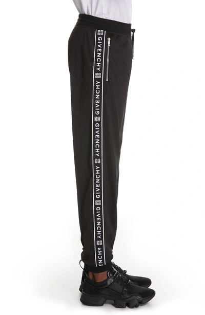 Shop Givenchy Logo Stripe Track Pants In Black