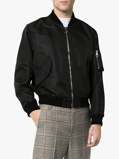 Shop Burberry Crest Print Bomber Jacket In A5377 Black