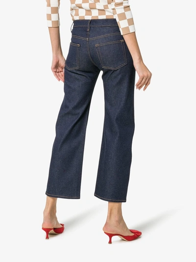 Shop Khaite Wendell Cropped Wide-leg Cotton-blend Jeans In Blue