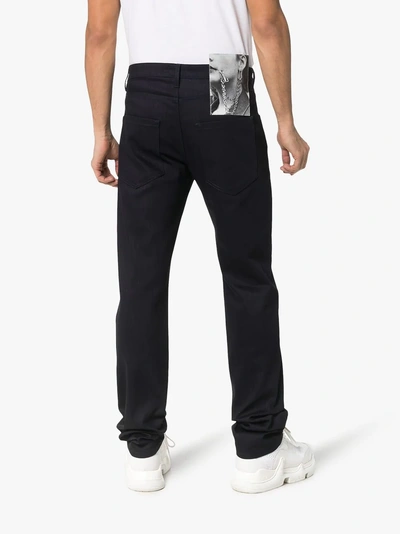 Shop Raf Simons Straight Leg Back Patch Jeans In Navy