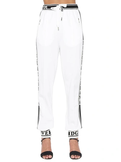 Shop Dolce & Gabbana Logo Striped Track Pants In White