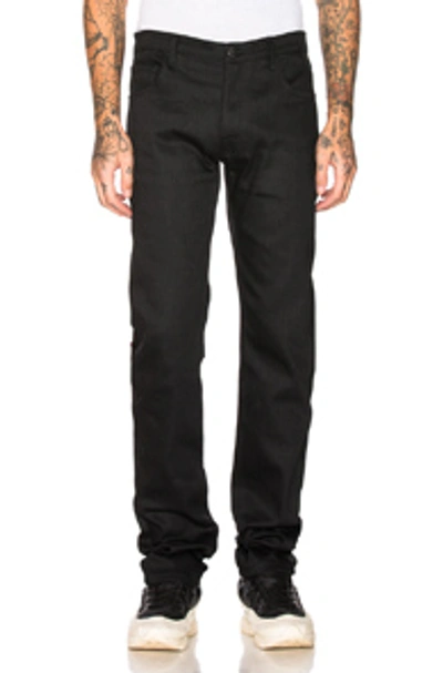 Shop Raf Simons Tape & Patch Denim Jeans In Black