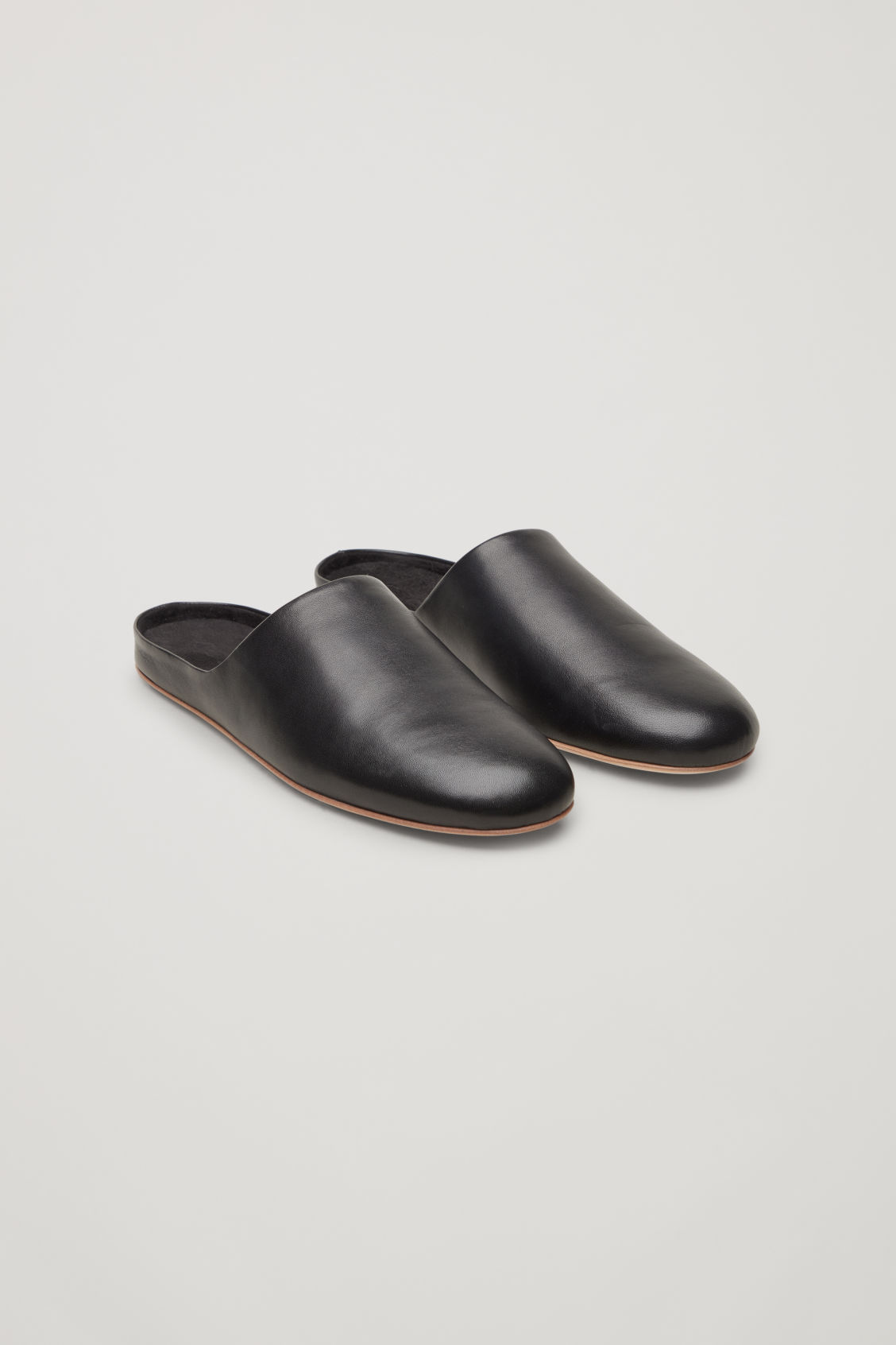 black leather slippers