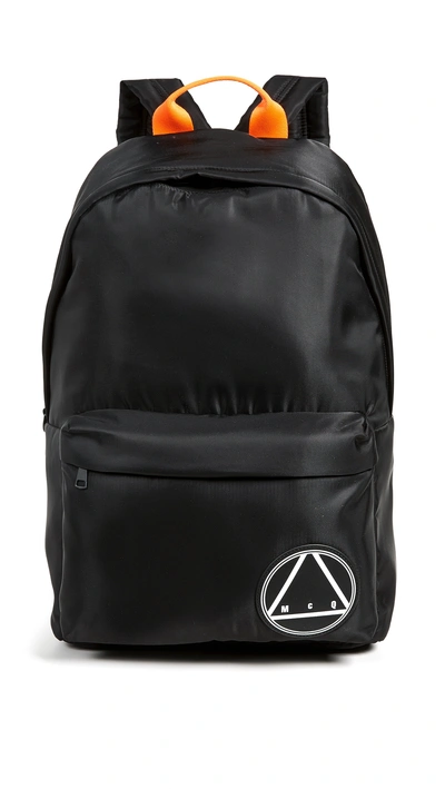Shop Mcq By Alexander Mcqueen Logo Patch Backpack In Black/rust Orange